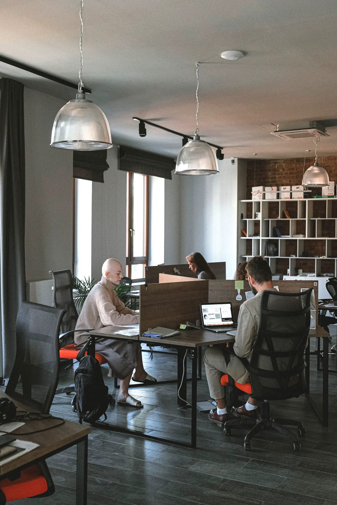 People at computers in a working open-plan office